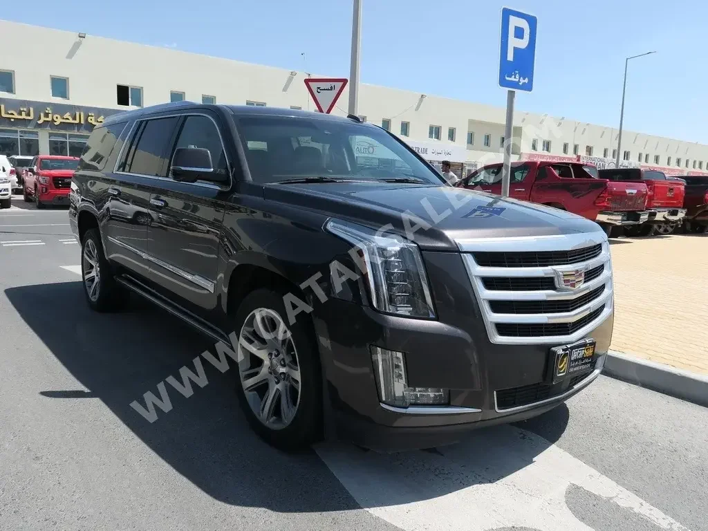 Cadillac  Escalade  2015  Automatic  128,000 Km  8 Cylinder  Four Wheel Drive (4WD)  SUV  Brown  With Warranty
