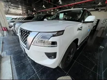 Nissan  Patrol  Titanium  2022  Automatic  0 Km  6 Cylinder  Four Wheel Drive (4WD)  SUV  White  With Warranty