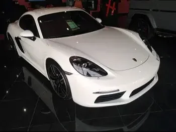 Porsche  Cayman  718  2018  Automatic  40,000 Km  4 Cylinder  Rear Wheel Drive (RWD)  Coupe / Sport  White  With Warranty