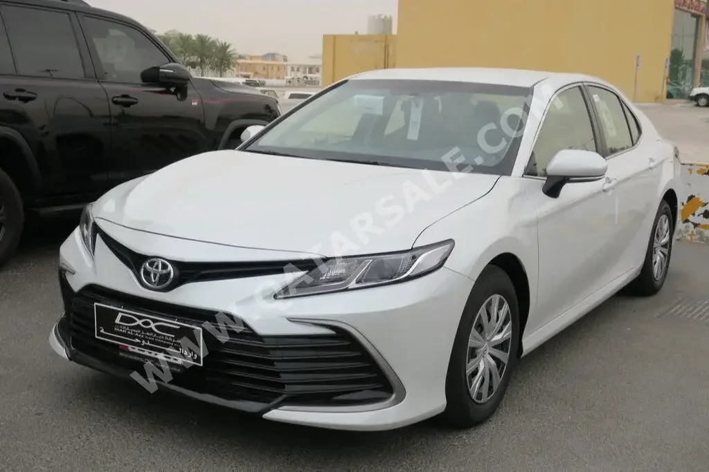 Toyota  Camry  LE  2023  Automatic  0 Km  4 Cylinder  Front Wheel Drive (FWD)  Sedan  White  With Warranty