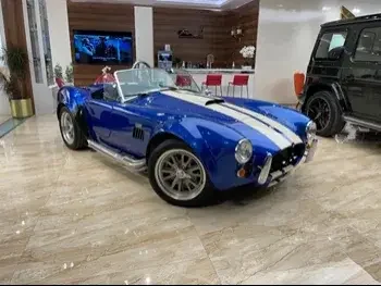 Ford  Cobra  1966  Manual  41,000 Km  8 Cylinder  Rear Wheel Drive (RWD)  Classic  Blue and Beige  With Warranty