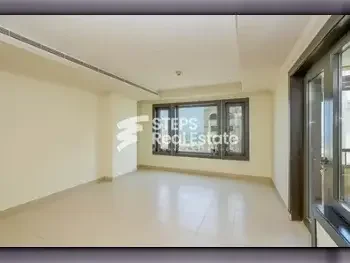 2 Bedrooms  Apartment  For Rent  in Doha -  The Pearl  Semi Furnished