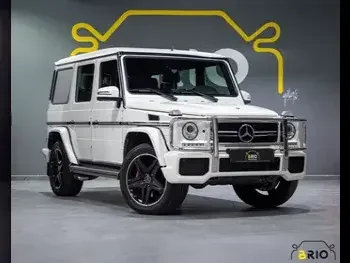 Mercedes-Benz  G-Class  63 AMG  2015  Automatic  60,000 Km  8 Cylinder  Four Wheel Drive (4WD)  SUV  White  With Warranty