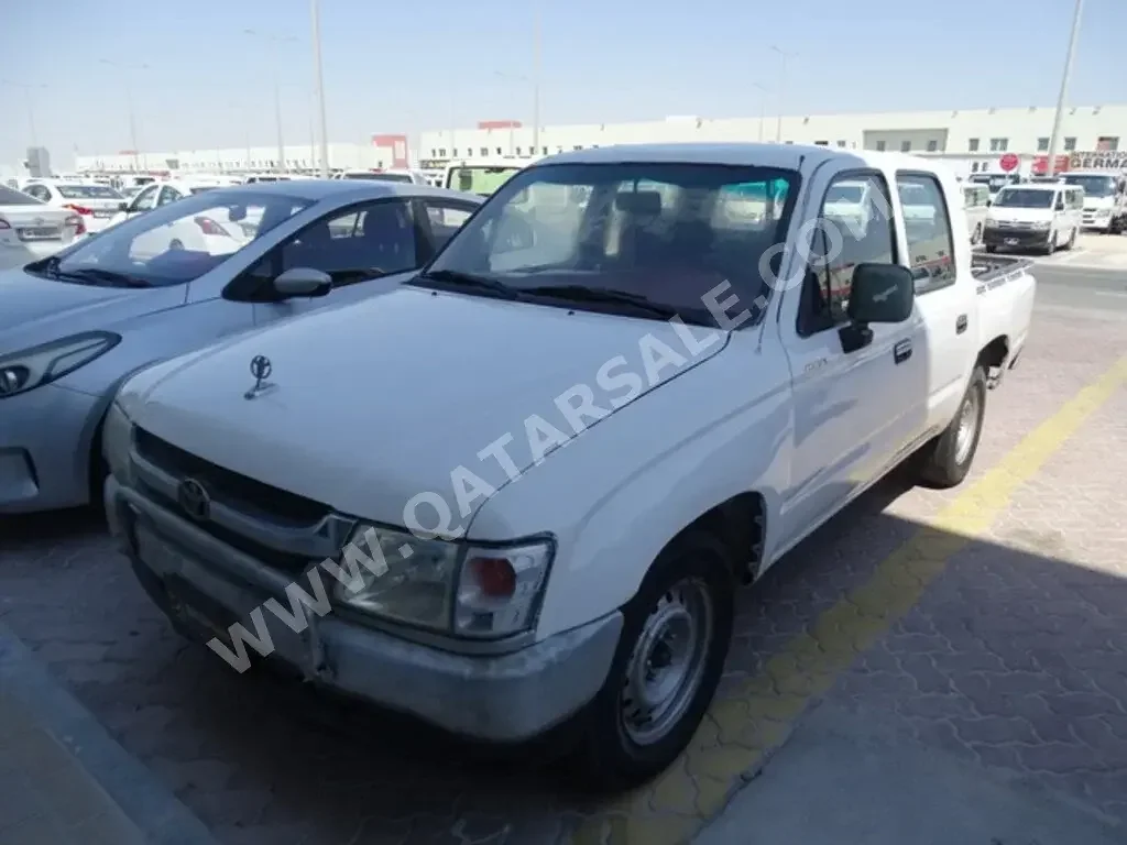 Toyota  Hilux  2003  Automatic  390,000 Km  4 Cylinder  Front Wheel Drive (FWD)  Pick Up  White  With Warranty