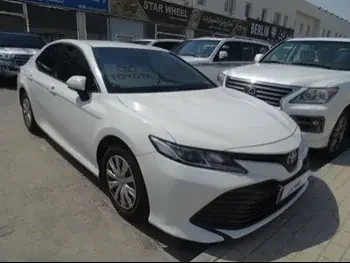 Toyota  Camry  LE  2019  Automatic  118,000 Km  4 Cylinder  Front Wheel Drive (FWD)  Sedan  White  With Warranty