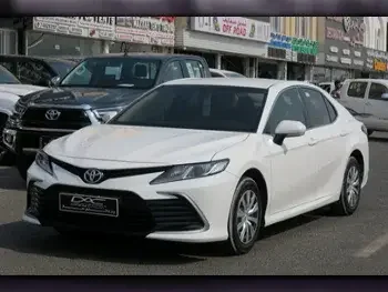 Toyota  Camry  LE  2021  Automatic  59,000 Km  4 Cylinder  Front Wheel Drive (FWD)  Sedan  White  With Warranty