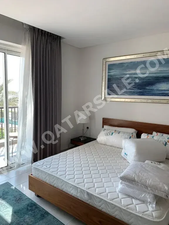 4 Bedrooms  Apartment  For Rent  in Doha -  The Pearl  Fully Furnished