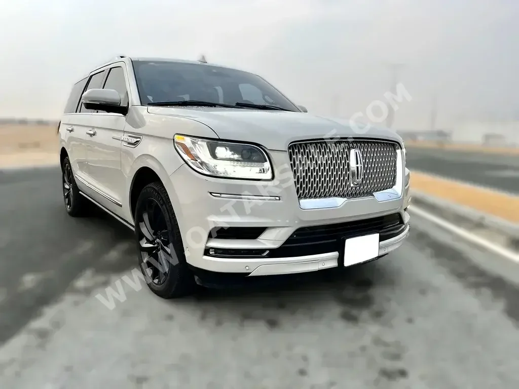 Lincoln  Navigator  2021  Automatic  60,000 Km  8 Cylinder  Four Wheel Drive (4WD)  SUV  White  With Warranty