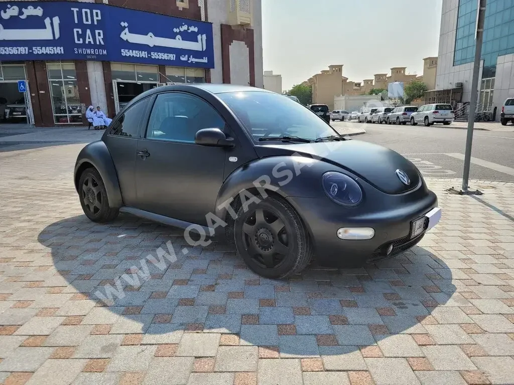 Volkswagen  Beetle  2003  Automatic  120,000 Km  4 Cylinder  Rear Wheel Drive (RWD)  Hatchback  Gray