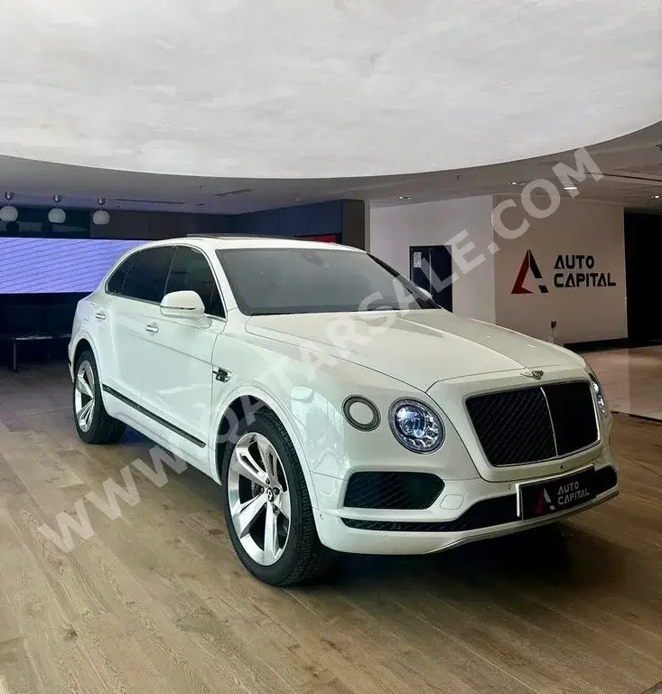 Bentley  Bentayga  2019  Automatic  61,000 Km  8 Cylinder  Four Wheel Drive (4WD)  SUV  White  With Warranty