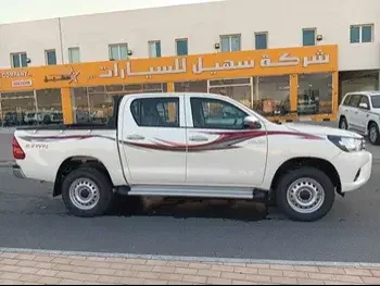 Toyota  Hilux  2023  Automatic  10,000 Km  4 Cylinder  Four Wheel Drive (4WD)  Pick Up  White  With Warranty
