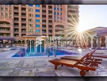 4 Bedrooms  Apartment  For Rent  in Doha -  The Pearl  Semi Furnished