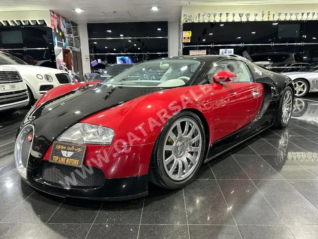  Bugatti  Veyron  2009  Automatic  15,000 Km  16 Cylinder  All Wheel Drive (AWD)  Coupe / Sport  Black and Red  With Warranty