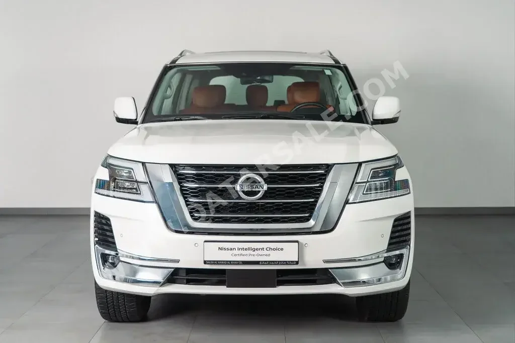 Nissan  Patrol  LE Titanium  2021  Automatic  904 Km  8 Cylinder  Four Wheel Drive (4WD)  SUV  White  With Warranty