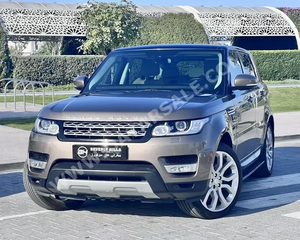  Land Rover  Range Rover  Sport HSE  2015  Automatic  99,000 Km  6 Cylinder  Four Wheel Drive (4WD)  SUV  Bronze  With Warranty