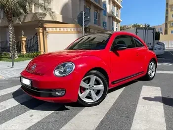 Volkswagen  Beetle  2015  Automatic  74,000 Km  4 Cylinder  Rear Wheel Drive (RWD)  Hatchback  Red