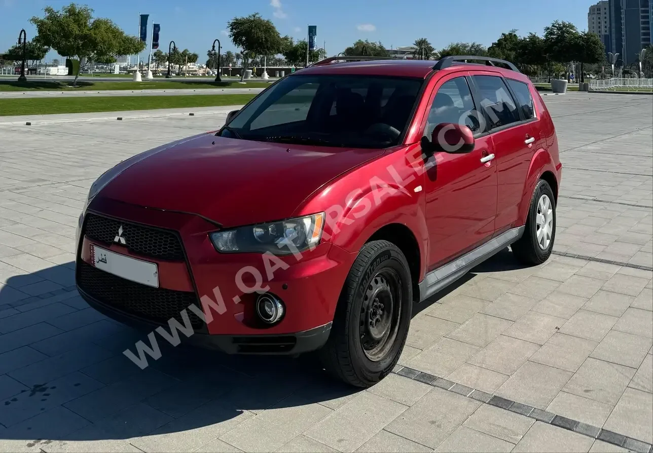 Mitsubishi  Outlander  2012  Automatic  375,000 Km  4 Cylinder  Four Wheel Drive (4WD)  SUV  Red