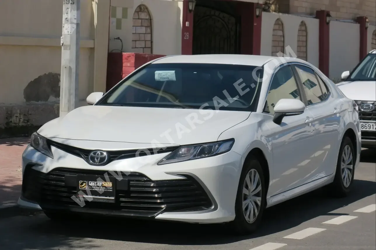 Toyota  Camry  LE  2023  Automatic  21,400 Km  4 Cylinder  Front Wheel Drive (FWD)  Sedan  White  With Warranty