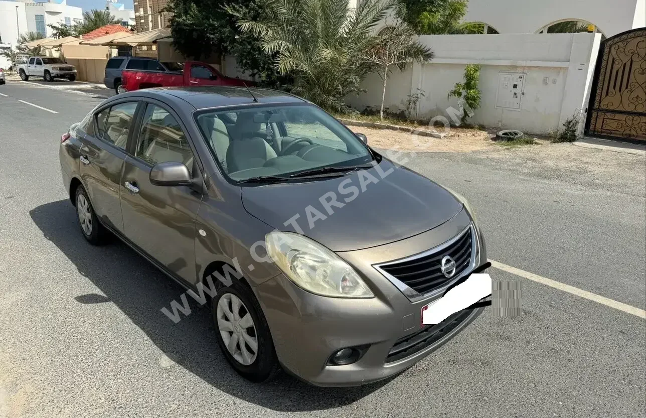 Nissan  Sunny  2014  Automatic  198,000 Km  4 Cylinder  Front Wheel Drive (FWD)  Sedan  Dark Brown  With Warranty