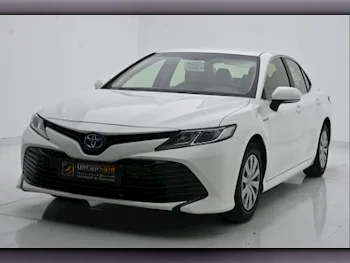 Toyota  Camry  Hybrid  2018  Automatic  55,000 Km  4 Cylinder  Front Wheel Drive (FWD)  Sedan  White