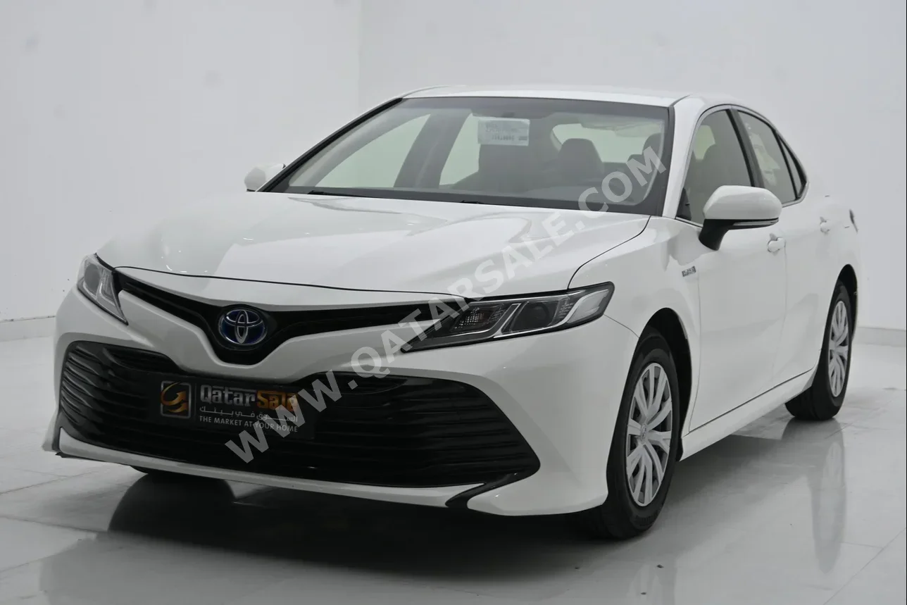 Toyota  Camry  Hybrid  2018  Automatic  55,000 Km  4 Cylinder  Front Wheel Drive (FWD)  Sedan  White