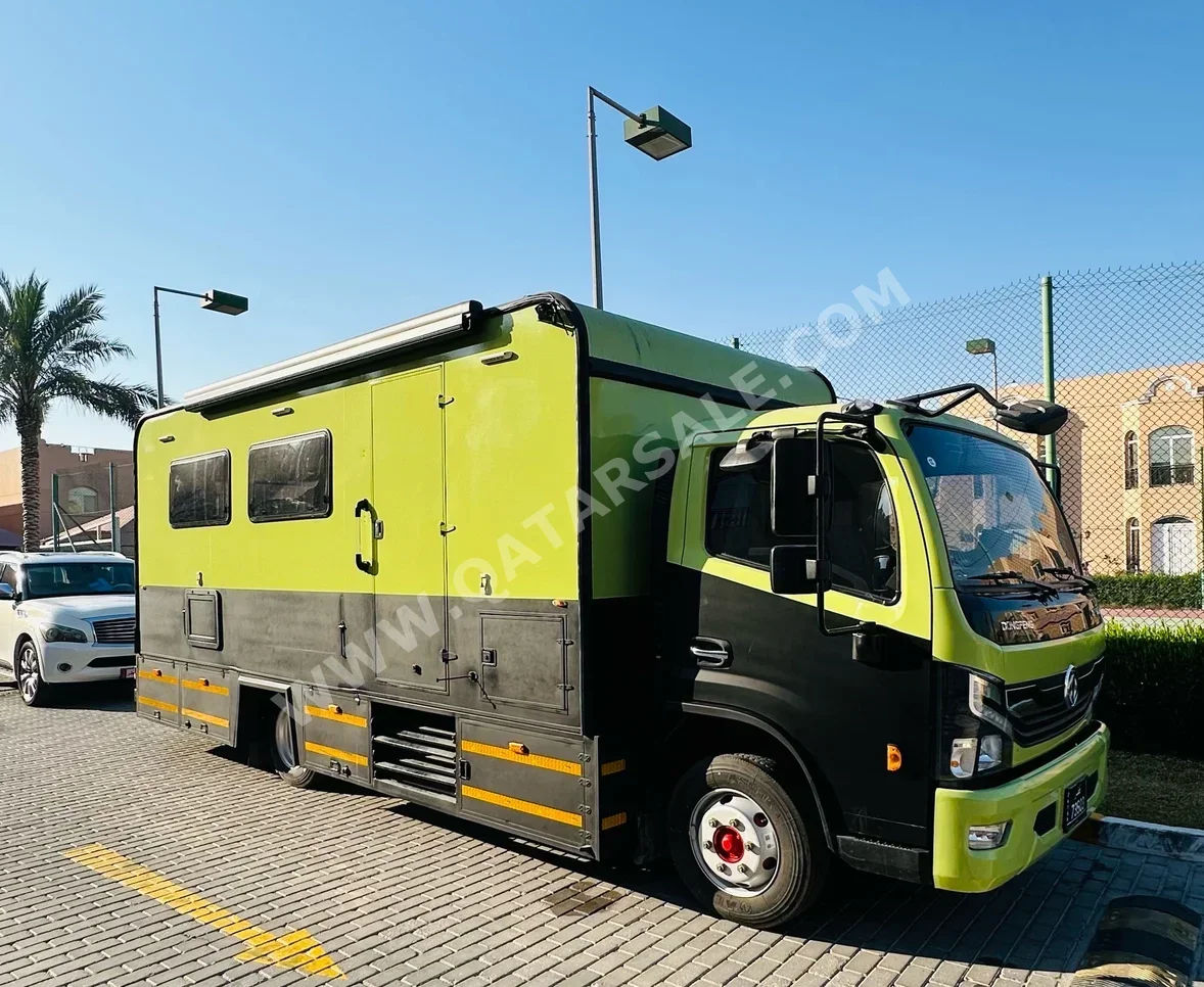 Caravan 2022  Black and Green Made in Qatar  1,200 Km