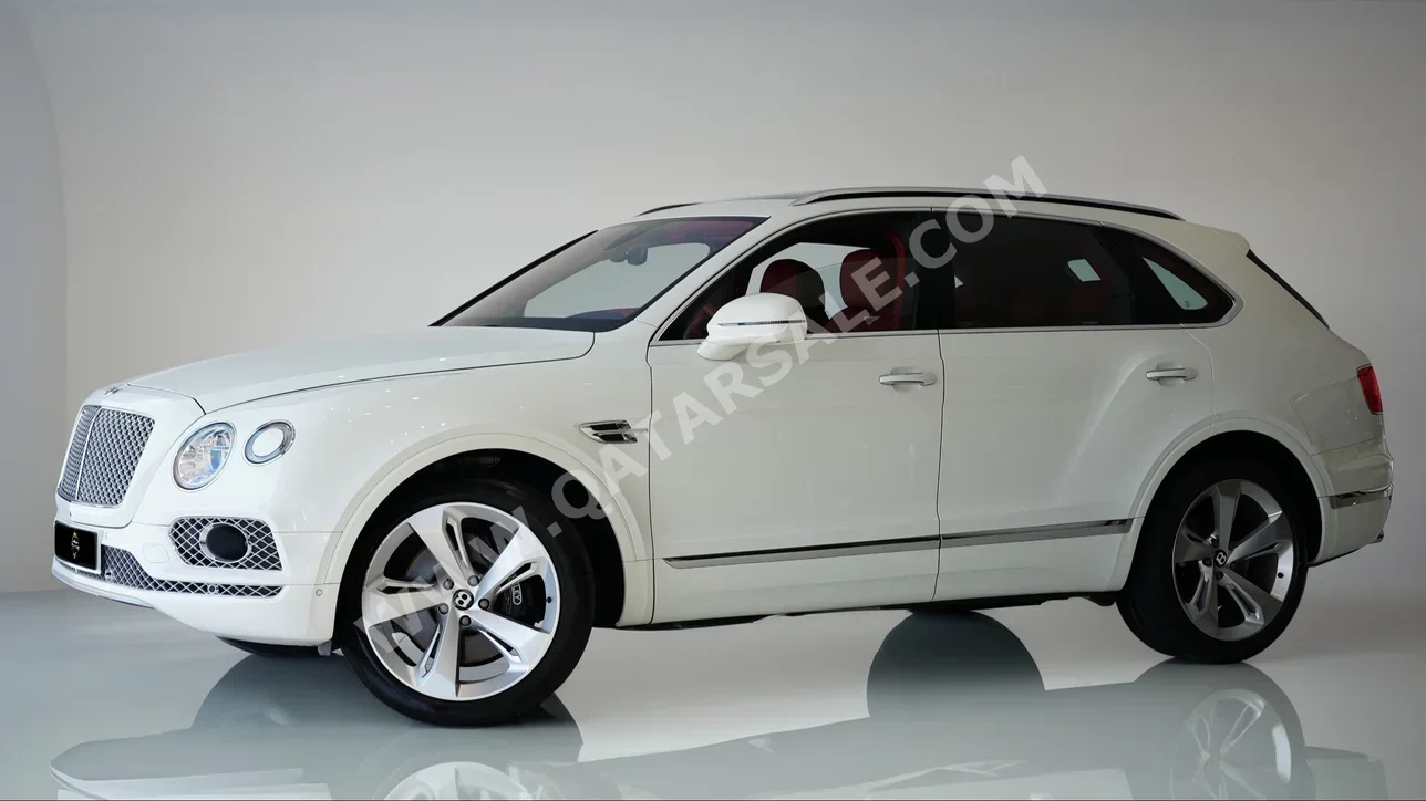 Bentley  Bentayga  2018  Automatic  74,000 Km  12 Cylinder  Four Wheel Drive (4WD)  SUV  White