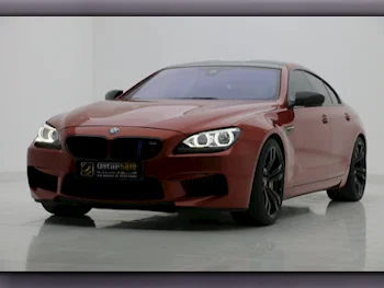 BMW  M-Series  6 Gran Coupe  2014  Automatic  144,000 Km  8 Cylinder  Rear Wheel Drive (RWD)  Sedan  Orange