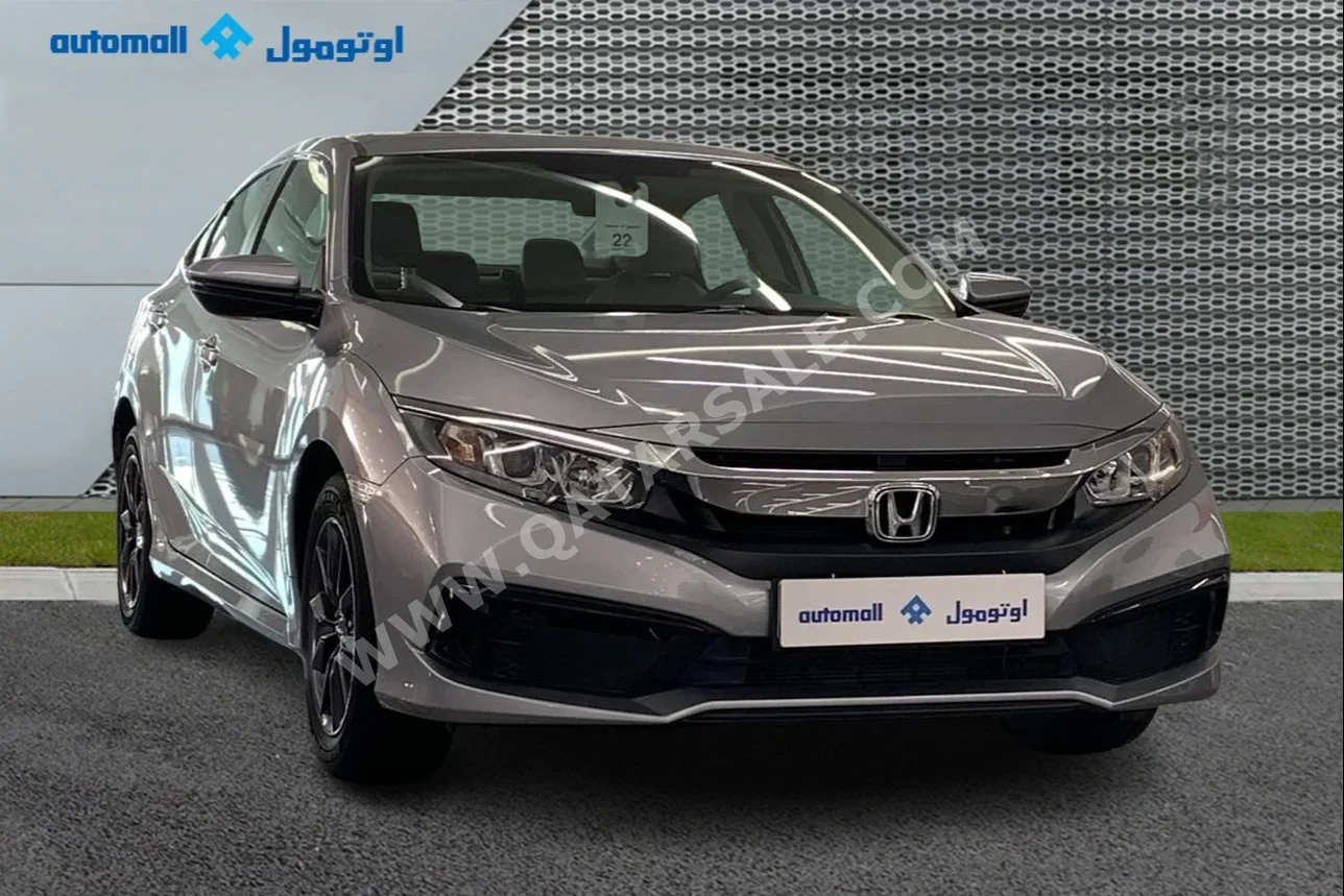 Honda  Civic  2021  Automatic  60,930 Km  4 Cylinder  Front Wheel Drive (FWD)  Sedan  Silver  With Warranty