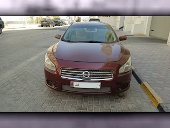 Nissan  Maxima  2010  Automatic  235,000 Km  6 Cylinder  Front Wheel Drive (FWD)  Sedan  Red  With Warranty