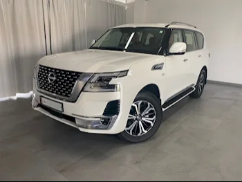 Nissan  Patrol  LE Titanium  2023  Automatic  2,400 Km  8 Cylinder  Four Wheel Drive (4WD)  SUV  White  With Warranty