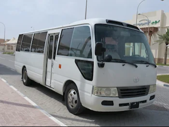 Toyota  Coaster  2015  Manual  228,000 Km  4 Cylinder  Front Wheel Drive (FWD)  Van / Bus  White