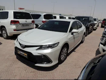 Toyota  Camry  LE  2023  Automatic  27,000 Km  4 Cylinder  Front Wheel Drive (FWD)  Sedan  White  With Warranty