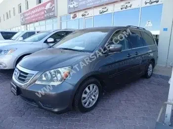Honda  Odyssey  2010  Automatic  98,000 Km  6 Cylinder  Front Wheel Drive (FWD)  SUV  Gray  With Warranty