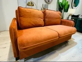 الأرائك والكنب والكراسي كنبة بمقعدين  - قماش  - برتقالي  - سرير أريكة