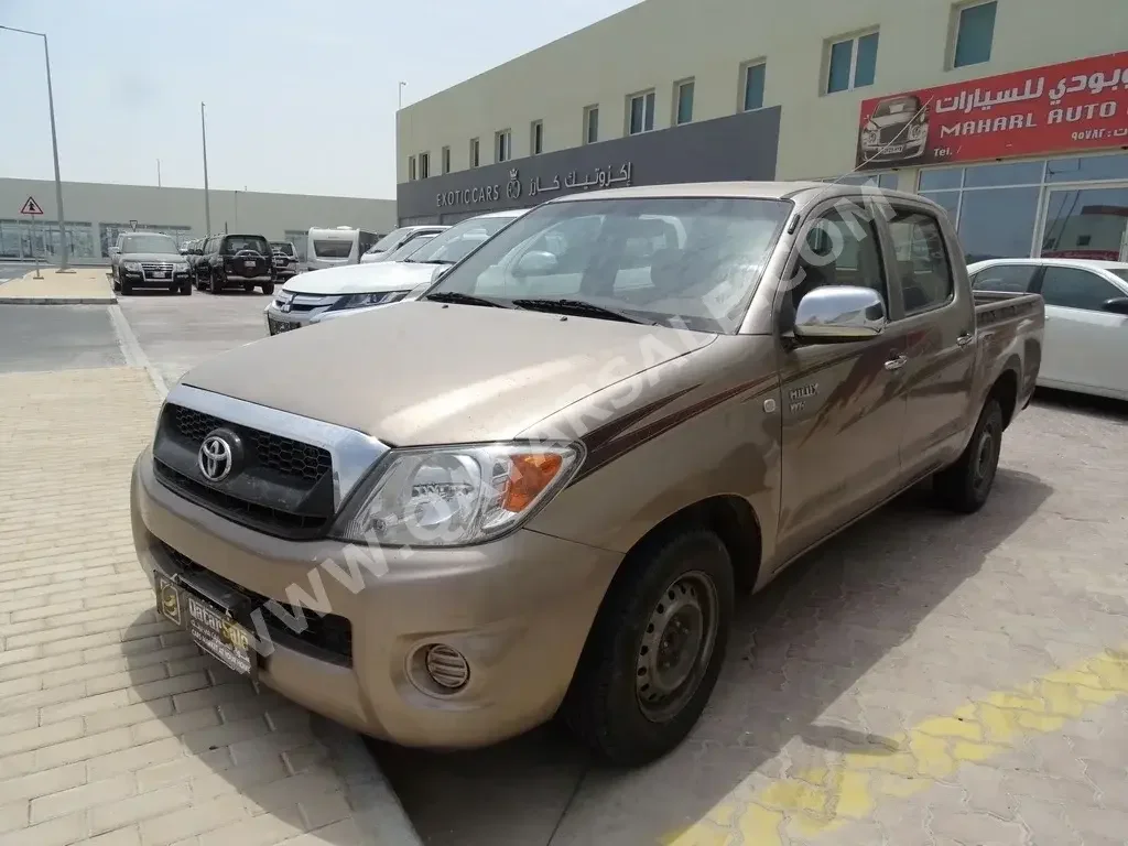Toyota  Hilux  2009  Manual  237,000 Km  4 Cylinder  Front Wheel Drive (FWD)  Pick Up  Beige  With Warranty