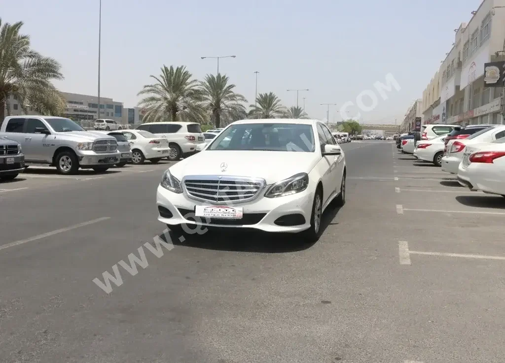 Mercedes-Benz  E-Class  200  2014  Automatic  45,000 Km  4 Cylinder  Rear Wheel Drive (RWD)  Sedan  White  With Warranty