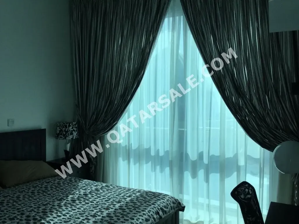 2 Bedrooms  Apartment  For Sale  in Doha -  Al Dafna  Fully Furnished